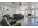 Open living room displaying fireplace, ceiling fans, and modern flooring, perfect for entertaining guests at 102 E Angela Dr, Phoenix, AZ 85022