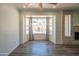 Comfortable living room area features bay windows offering natural light and views of outdoor space at 102 E Angela Dr, Phoenix, AZ 85022