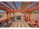 Covered outdoor area with stylish pergola, built-in benches, and a grill, perfect for entertaining at 102 E Angela Dr, Phoenix, AZ 85022