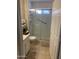Neutral bathroom featuring a glass shower with safety bar and updated fixtures at 11360 E Keats Ave # 75, Mesa, AZ 85209
