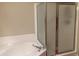 Bathroom featuring a soaking tub and a glass enclosed shower at 11360 E Keats Ave # 75, Mesa, AZ 85209