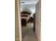 Bedroom featuring carpet, and a wood bed frame with red and tan bedding at 11360 E Keats Ave # 75, Mesa, AZ 85209
