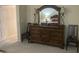Bedroom featuring a wooden dresser, chairs, lamps, and a mirror at 11360 E Keats Ave # 75, Mesa, AZ 85209
