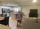 Open-concept kitchen featuring stainless steel appliances and an island with bar seating at 11360 E Keats Ave # 75, Mesa, AZ 85209