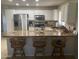 Bright kitchen featuring stainless steel appliances, white cabinetry, and a bar counter with seating at 11360 E Keats Ave # 75, Mesa, AZ 85209