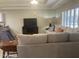 Spacious living room featuring a sectional sofa, tv and neutral decor at 11360 E Keats Ave # 75, Mesa, AZ 85209