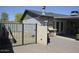 Backyard with BBQ, sink, small grass area, and an iron fence, providing a practical outdoor space at 12601 N 34Th St, Phoenix, AZ 85032