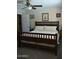 Bedroom with wooden bed frame, neutral colors, and ceiling fan at 12601 N 34Th St, Phoenix, AZ 85032