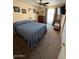Bedroom with a ceiling fan, a large window, and a comfortable bed at 12601 N 34Th St, Phoenix, AZ 85032