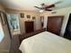 Bedroom features a ceiling fan and ensuite bathroom, perfect for relaxation at 12601 N 34Th St, Phoenix, AZ 85032