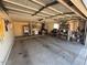 Spacious garage with storage, a utility sink, and side entrance, offering ample room and functionality at 12601 N 34Th St, Phoenix, AZ 85032
