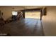 A spacious, well-lit garage with an open door, offering ample space for storage and parking at 12601 N 34Th St, Phoenix, AZ 85032