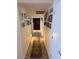 Hallway adorned with framed photographs and a decorative rug at 12601 N 34Th St, Phoenix, AZ 85032