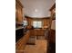 Galley kitchen featuring wood cabinets, granite countertops, and stainless appliances at 12601 N 34Th St, Phoenix, AZ 85032