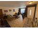 Warm and inviting living area with comfortable seating, tile flooring, and seamless flow into the dining space, perfect for Gathering time at 12601 N 34Th St, Phoenix, AZ 85032