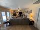 Spacious living area featuring a cozy fireplace, comfortable seating, and seamless access to the outdoors, ideal for indoor-outdoor living at 12601 N 34Th St, Phoenix, AZ 85032