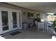 Covered patio with white chairs and a table - great for outdoor dining at 12601 N 34Th St, Phoenix, AZ 85032