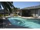 Backyard view featuring an outdoor pool, covered patio, and well-maintained landscaping at 12601 N 34Th St, Phoenix, AZ 85032