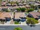 This beautiful home is located in a quiet neighborhood and features a well-manicured lawn and mature trees at 13323 W Rancho Dr, Litchfield Park, AZ 85340
