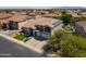 Beautiful two-story home with a well-manicured lawn, attached three-car garage and a balcony at 13323 W Rancho Dr, Litchfield Park, AZ 85340