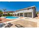 This home features a backyard with a pool and sports court at 13323 W Rancho Dr, Litchfield Park, AZ 85340