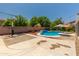 The backyard has a sport court, pool, and mature landscaping at 13323 W Rancho Dr, Litchfield Park, AZ 85340