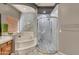 Bathroom featuring a soaking tub, glass enclosed shower, and a double vanity at 13323 W Rancho Dr, Litchfield Park, AZ 85340