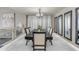 Dining room featuring a long wooden table, chandelier, and elegant decor at 13323 W Rancho Dr, Litchfield Park, AZ 85340