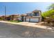 This two-story home features a balcony and a spacious three-car garage at 13323 W Rancho Dr, Litchfield Park, AZ 85340