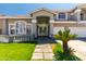 Charming front entrance with a double door and decorative stonework at 13323 W Rancho Dr, Litchfield Park, AZ 85340
