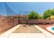 Backyard sport court area with a view of the pool at 13323 W Rancho Dr, Litchfield Park, AZ 85340