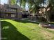 Large, lush courtyard with seating and mature trees at 1432 W Emerald Ave # 686, Mesa, AZ 85202