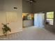 Open living room with vaulted ceilings and access to kitchen with stainless appliances at 1432 W Emerald Ave # 686, Mesa, AZ 85202