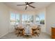 Cozy breakfast nook with large windows and plantation shutters providing ample natural light and neighborhood views at 15134 W Waterford Dr, Surprise, AZ 85374
