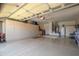 Spacious garage with organized storage cabinets along the walls, providing ample space for vehicles and belongings at 15134 W Waterford Dr, Surprise, AZ 85374