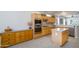 Well-equipped kitchen with stainless steel appliances and light wood cabinetry offering plenty of storage space at 15134 W Waterford Dr, Surprise, AZ 85374