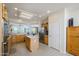Open-concept kitchen featuring a center island, stainless appliances, and abundant cabinet space for storage solutions at 15134 W Waterford Dr, Surprise, AZ 85374