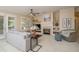 Inviting living room with a cozy fireplace, comfortable seating, and neutral tones creating a warm atmosphere at 15134 W Waterford Dr, Surprise, AZ 85374