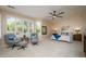 Serene main bedroom with large windows, plantation shutters, and a relaxing seating area for unwinding at 15134 W Waterford Dr, Surprise, AZ 85374