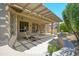 Cozy covered patio with ample seating and outdoor living space, perfect for relaxation at 15134 W Waterford Dr, Surprise, AZ 85374