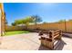 Backyard featuring a seating area, low-maintenance landscaping, and privacy wall at 152 N 194Th Ln, Buckeye, AZ 85326