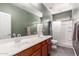 Elegant bathroom featuring double sinks, a shower, and a clean, modern design with neutral color schemes at 152 N 194Th Ln, Buckeye, AZ 85326