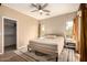 Spacious bedroom with a neutral color palette and updated ceiling fan at 152 N 194Th Ln, Buckeye, AZ 85326