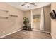 Bedroom with hardwood floors, neutral walls and large windows for natural light at 152 N 194Th Ln, Buckeye, AZ 85326