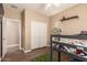 Bright ' bedroom with a bunk bed, laminate flooring, and a playful ambiance for a comfortable and fun space at 152 N 194Th Ln, Buckeye, AZ 85326