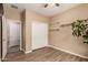 Bedroom with hardwood floors, neutral walls, and large windows for natural light, with closet storage at 152 N 194Th Ln, Buckeye, AZ 85326