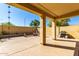 Enjoy the covered patio with concrete pillars, benches, barbeque, and clear sky at 152 N 194Th Ln, Buckeye, AZ 85326