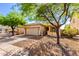 Well-maintained single-story house with desert landscaping, a two-car garage and mature shade trees at 152 N 194Th Ln, Buckeye, AZ 85326