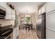 Kitchen featuring stainless steel refrigerator and an adjacent breakfast nook at 152 N 194Th Ln, Buckeye, AZ 85326