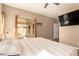 Bright main bedroom featuring a large window, neutral tones, and a modern ceiling fan for comfortable living at 152 N 194Th Ln, Buckeye, AZ 85326